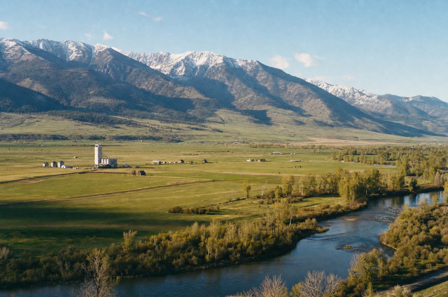 Hay meadows and the cottonwood-lined Jefferson River below the Tobacco Root Mountains near Whitehall, Montana